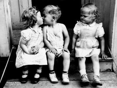 funny-kids-boy-and-girl-kissing-while-other-girl-gets-angry